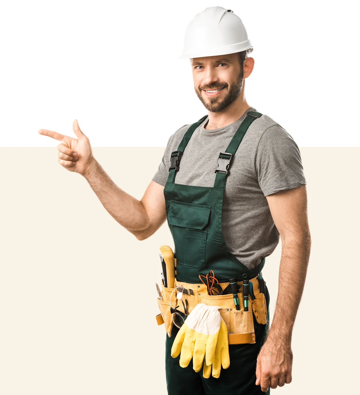 Smiling construction worker pointing, wearing hard hat.