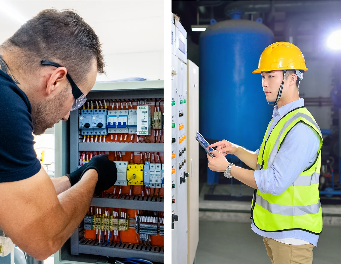 Two electricians working on electrical panels.