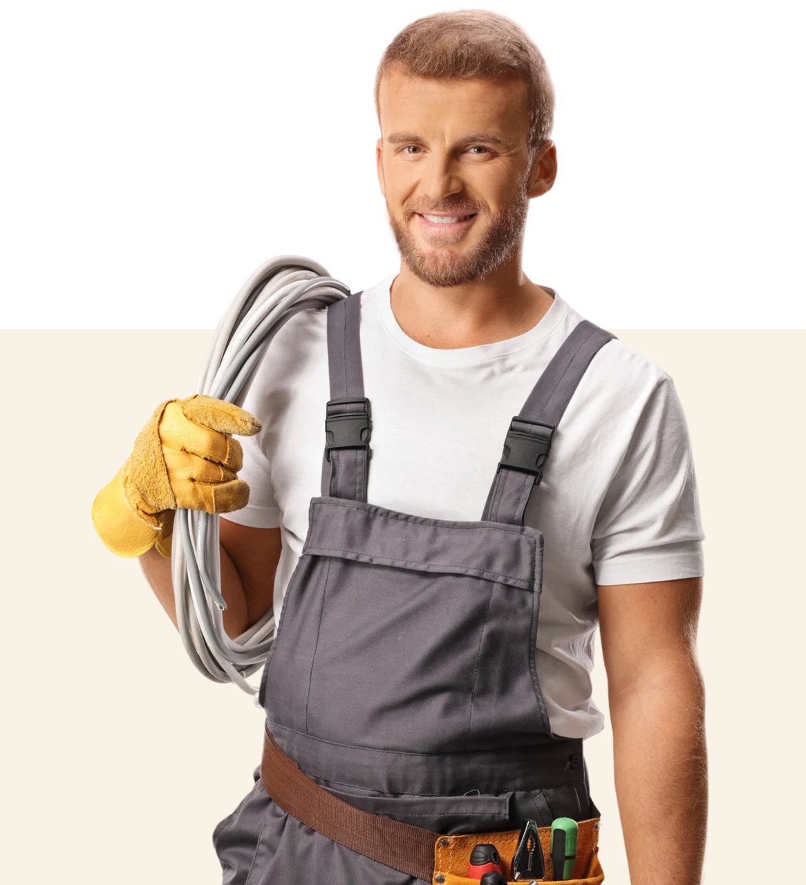 Man in overalls holding electrical cable.